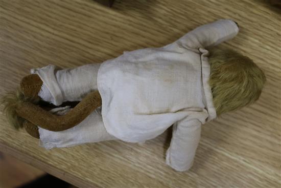 An early 20th century Bisque jointed doll with open mouth and sleeping eyes, and two small plush animals